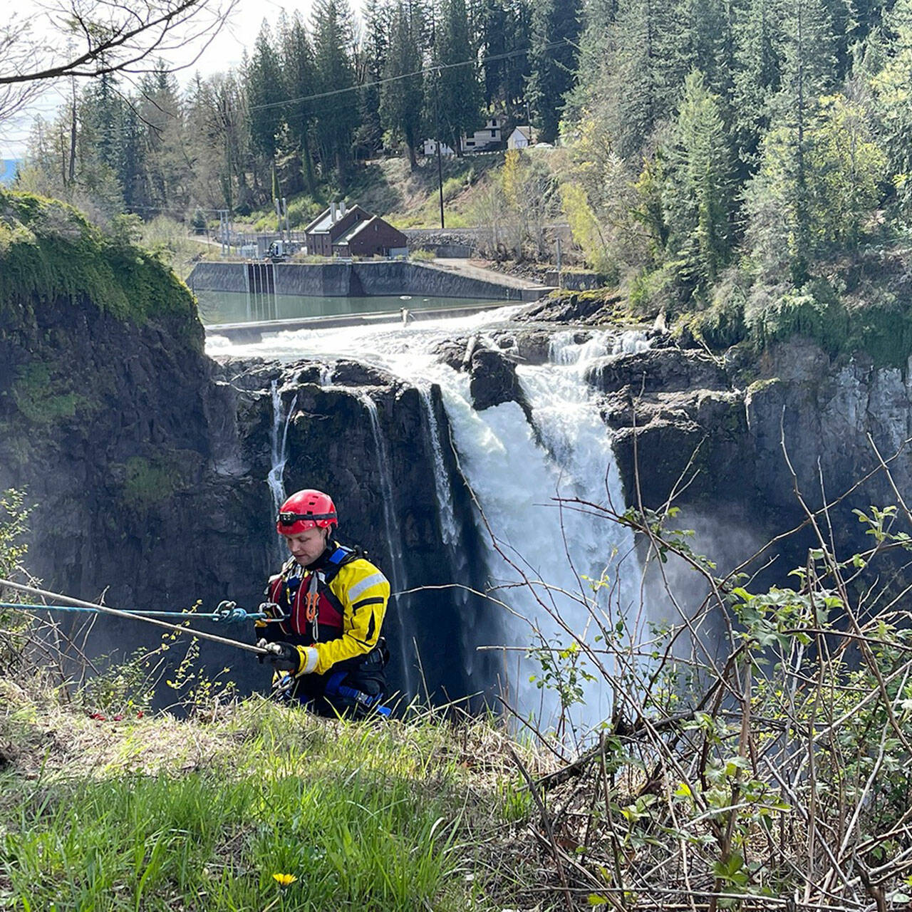 A firefighter starts to rappel to the Snoqualmie River near Snoqualmie Falls as part of a river rescue training session. COURTESY PHOTO, Puget Sound Fire