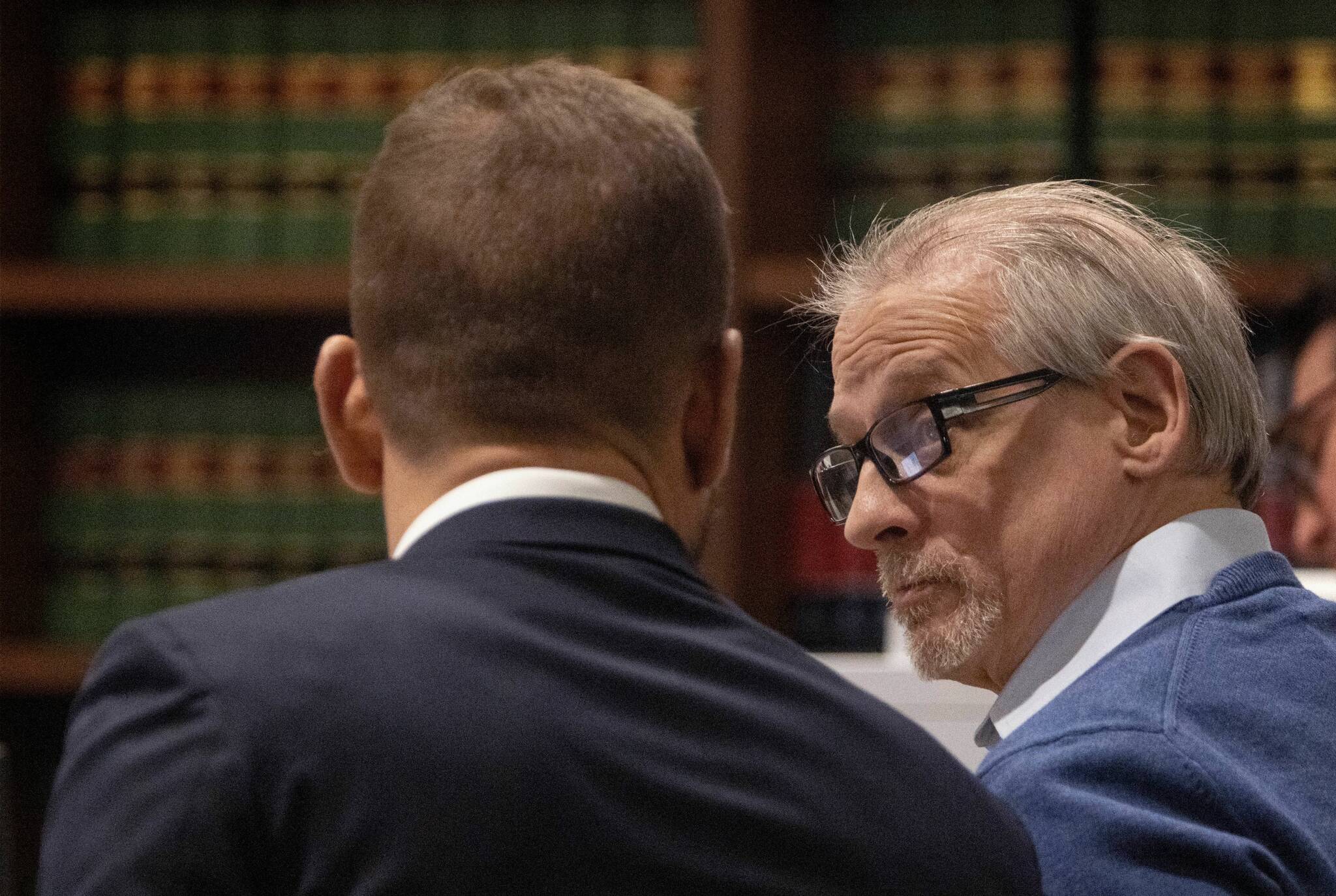 Patrick Nicholas, 59, (right) confers with his defense attorney David Montes after opening statements are made Monday, April 17, 2023, at the Maleng Regional Justice Center in Kent. Nicholas is standing trial for the December 1991 killing of 16-year-old Sarah Yarborough. Ellen M. Banner/The Seattle Times