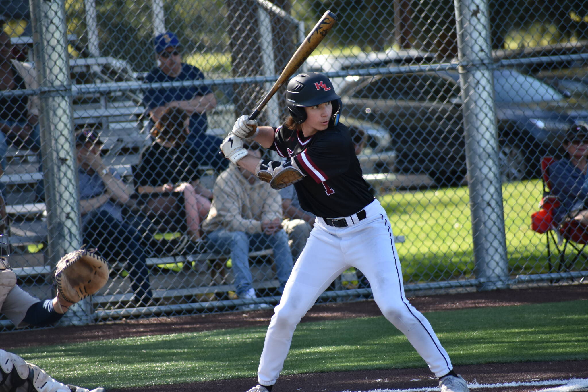 Kentlake second baseman Christopher Moore at the plate against the Spartans. Ben Ray / The Reporter