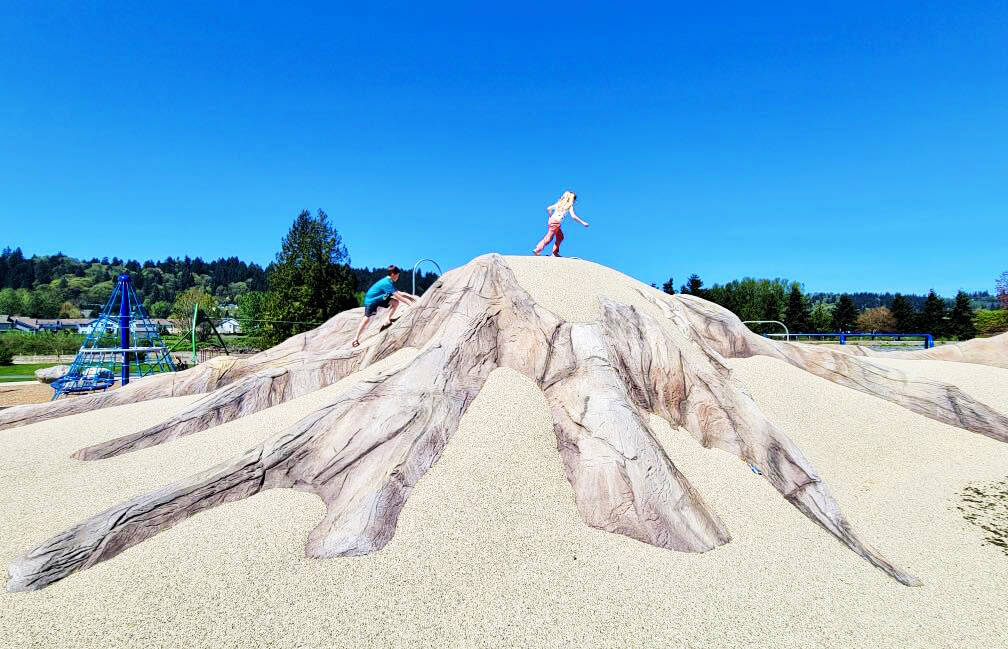 Children play on the new Mount Rainier climbing structure at the relocated Van Doren’s Landing Park in Kent along Russell Road. COURTESY PHOTO, City of Kent Parks