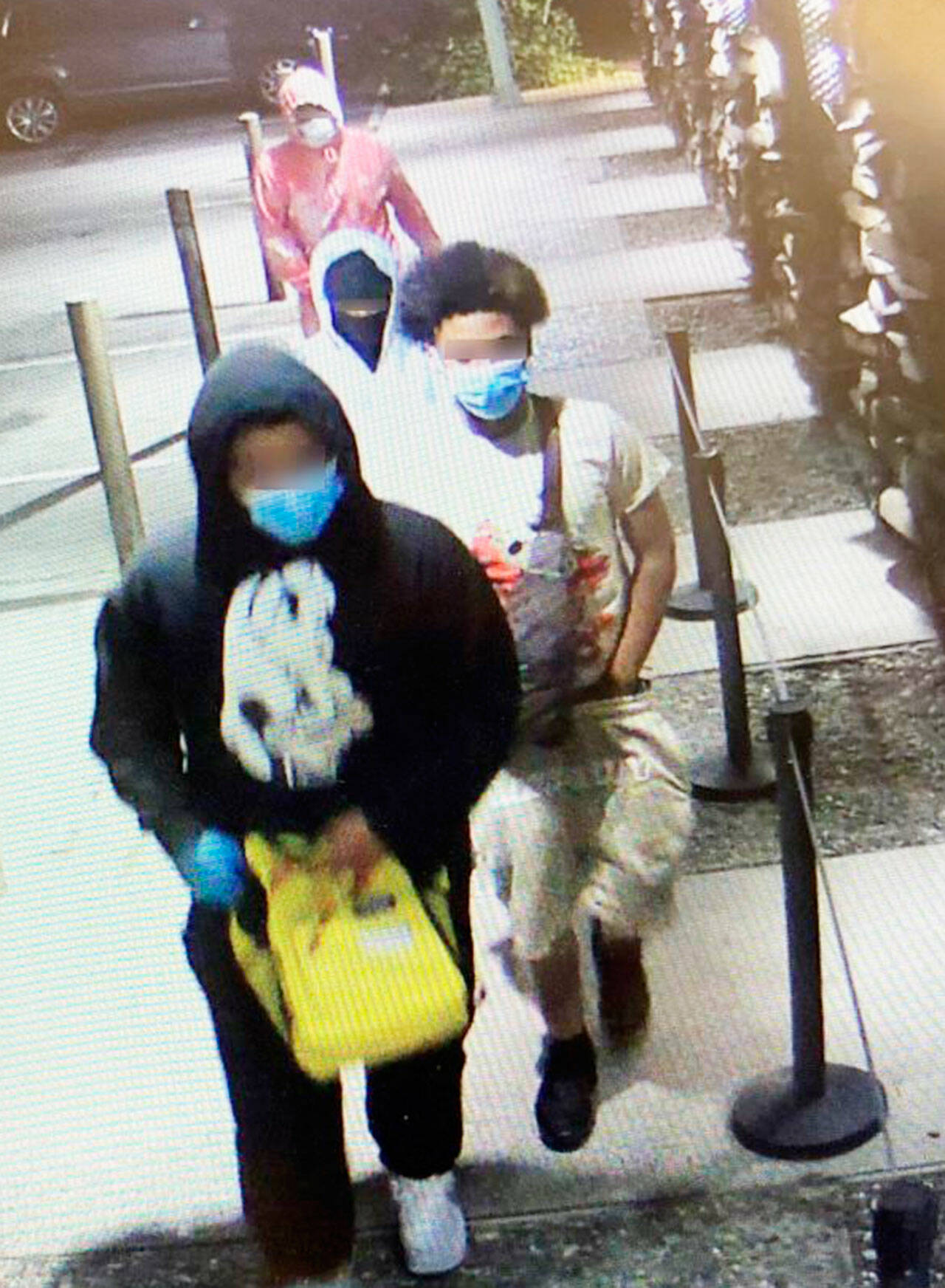 Four males were captured on video surveillance entering a Bellevue marijuana dispensary on the night of June 5. The four were arrested for investigation of armed robbery about two hours later on June 6 at a Kent apartment complex. COURTESY IMAGE, Bellevue Police