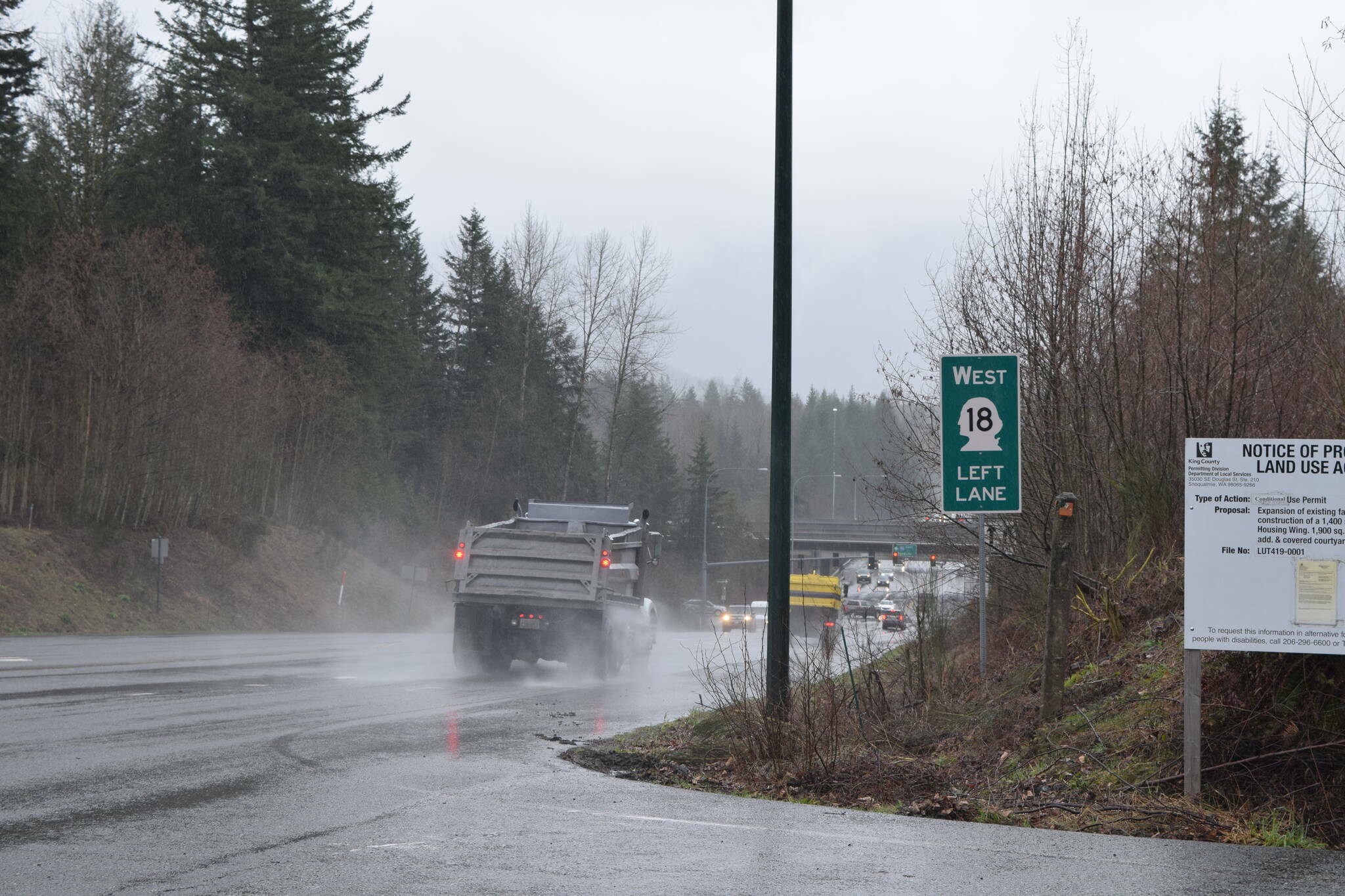 A State Route 18 sign in Snoqualmie before the SR 18/I-90 interchange. File photo by Conor Wilson/Sound Publishing