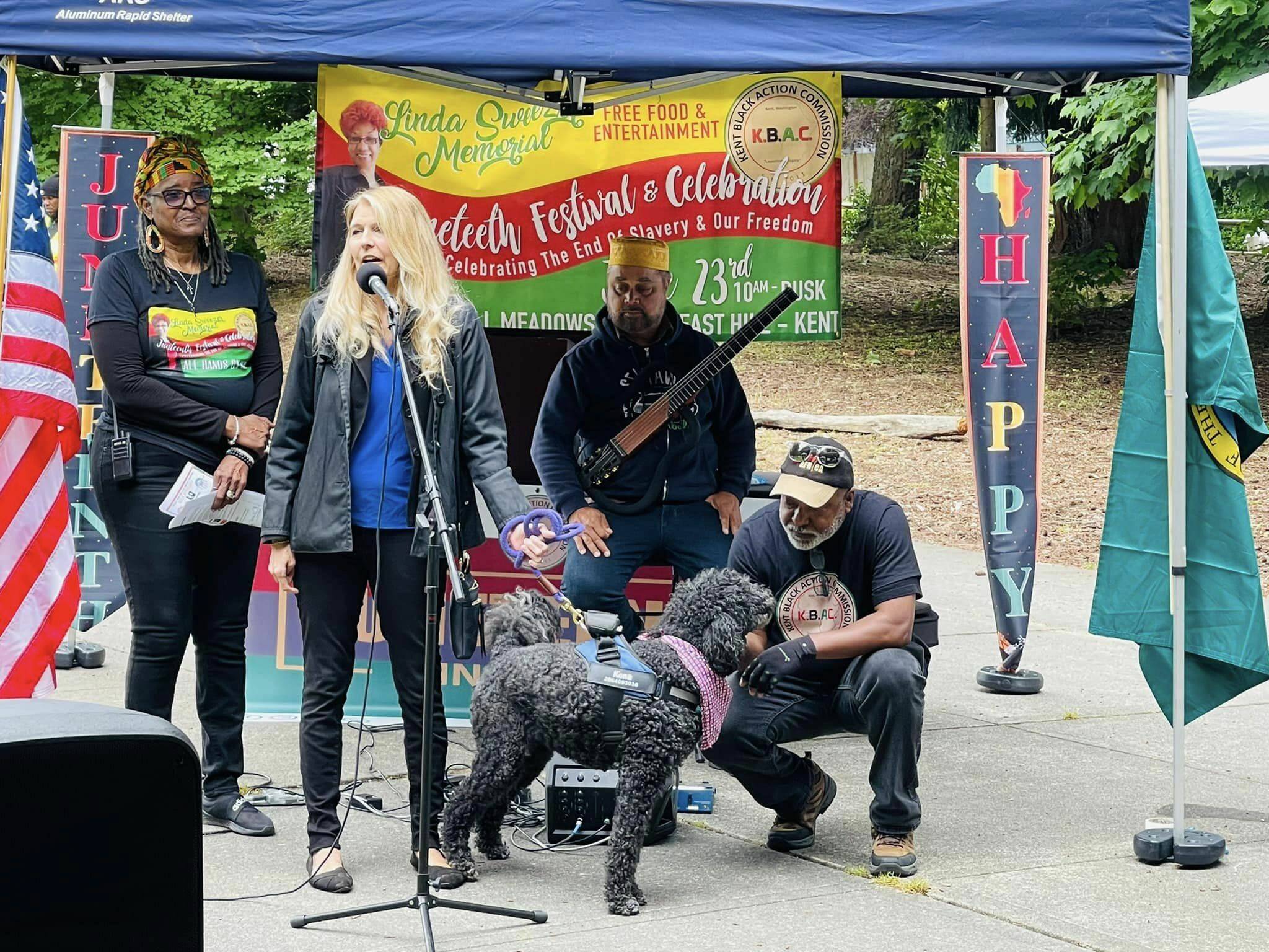 State Rep. Tina Orwall, D-Des Moines, speaks at the 2022 Juneteenth celebration in Kent. This year’s event is June 17 at the Kent YMCA. Behind Orwall from left to right are Gwen Allen-Carston, Michael Powers and Charles Carston. COURTESY PHOTO, Kent Black Action Commission