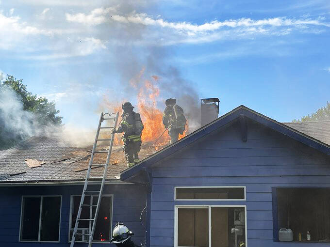 Firefighters battle a blaze June 7 at a Maple Valley house in the 20600 block of 223rd Place SE. COURTESY PHOTO, Puget Sound Fire