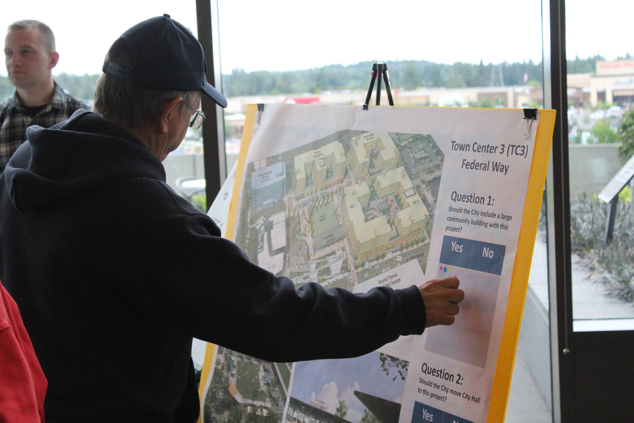 Visitors to the “Rising from The Dust” event share their thoughts on whether Federal Way should invest in a community building or a new City Hall at the upcoming TC-3 project. Alex Bruell / The Mirror