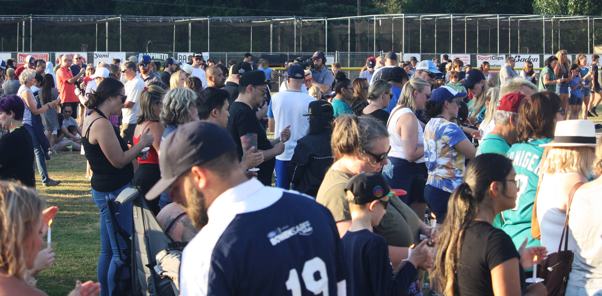 A crowd fills the outfield at a July 20 candlelight vigil for Gabriel Coury. STEVE HUNTER, Kent Reporter