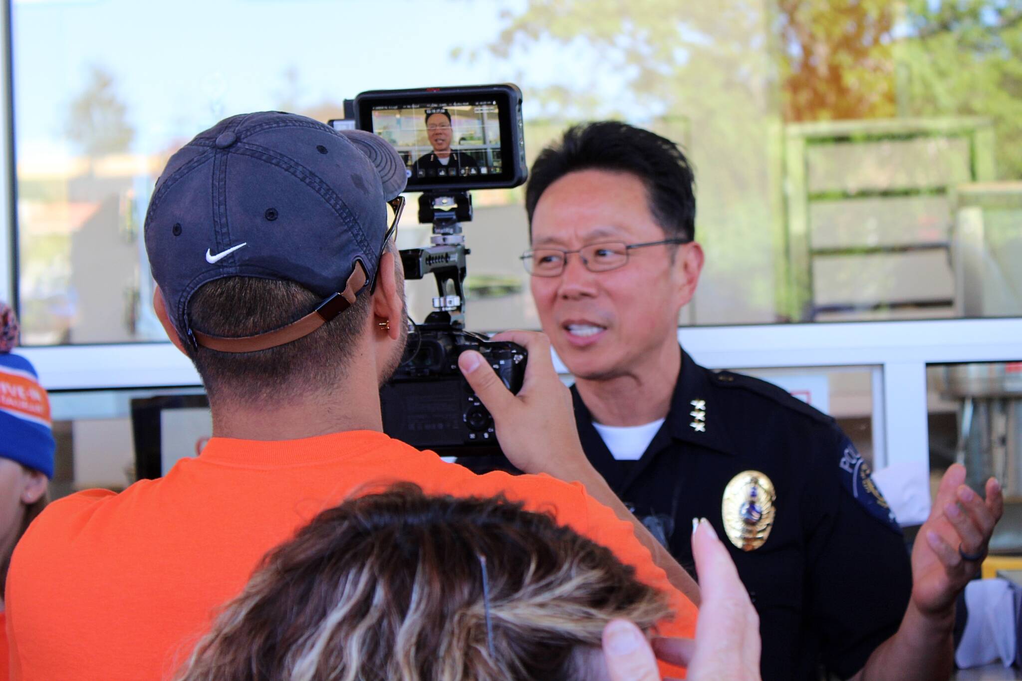 Federal Way Police Chief Andy Hwang was among the public officials interviewed July 27 at the opening of Dick’s Drive-In in Federal Way. (Alex Bruell / The Mirror)