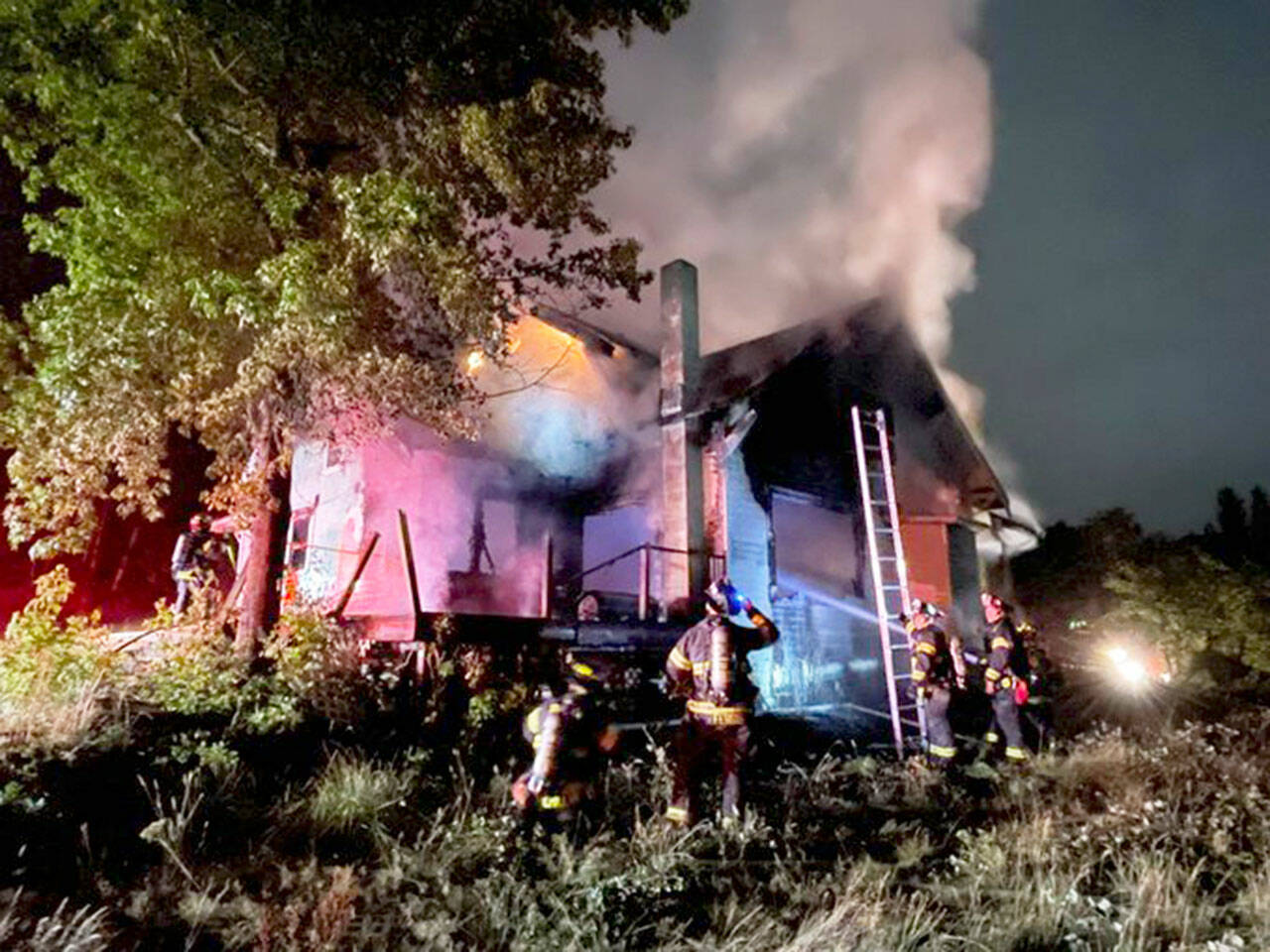Firefighters battle a blaze Monday, Aug. 7 at a vacant Kent house in the 20400 block of 91st Avenue S. COURTESY PHOTO, Puget Sound Fire