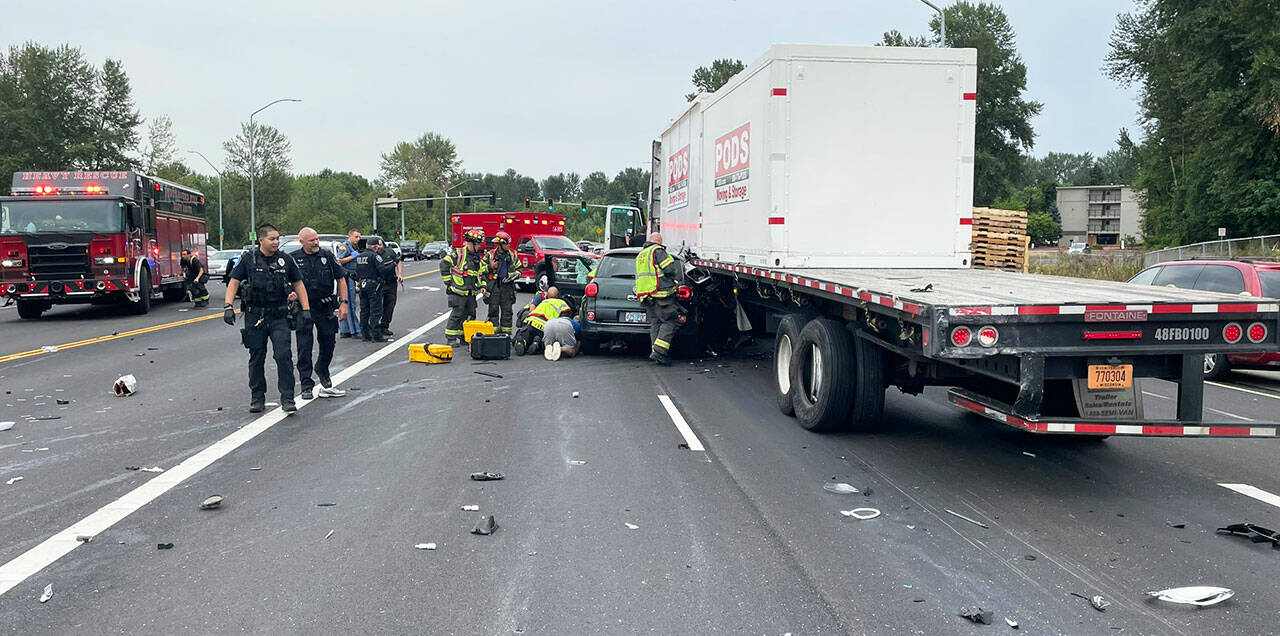 A car reportedly traveling at a high rate of speed collided with a truck Saturday, Aug. 5 in Kent near Kent Des Moines Road and West Meeker Street. COURTESY PHOTO, Puget Sound Fire