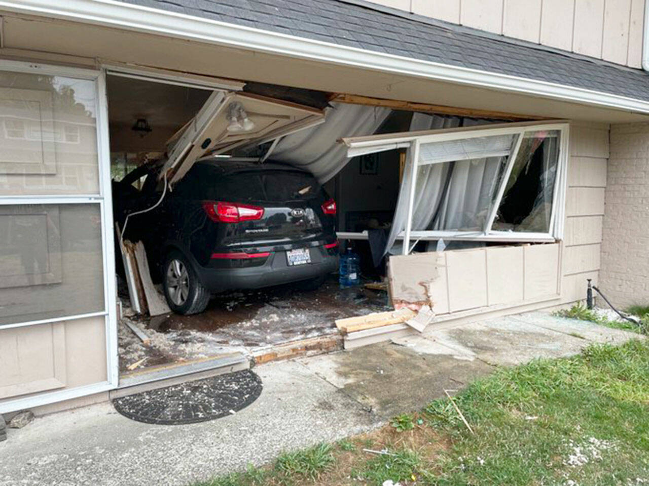 A vehicle crashed into a Kent home Tuesday morning, Aug. 8 at 24005 35th Pl. S. Nobody was injured. COURTESY PHOTO, Puget Sound Fire