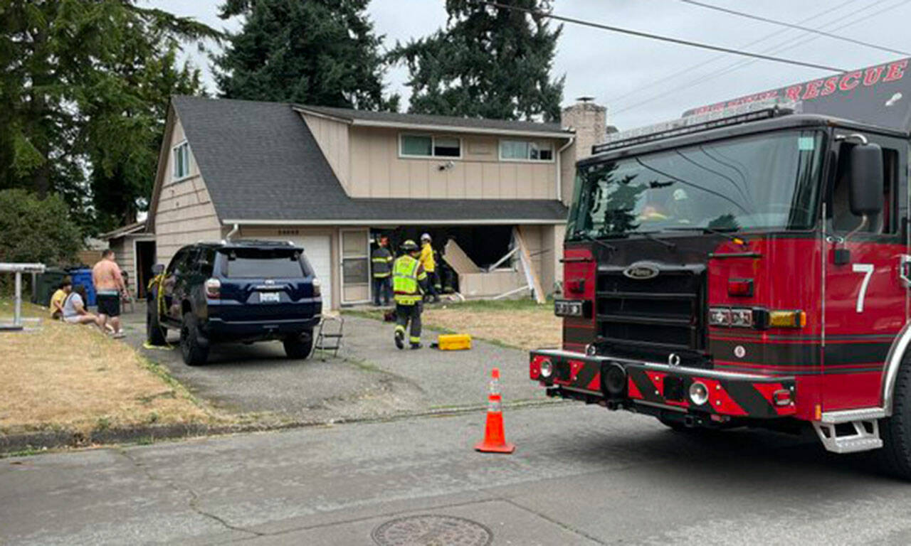 Puget Sound Fire crews work to stabilize a Kent home after a vehicle crashed into it Aug. 8. COURTESY PHOTO, Puget Sound Fire