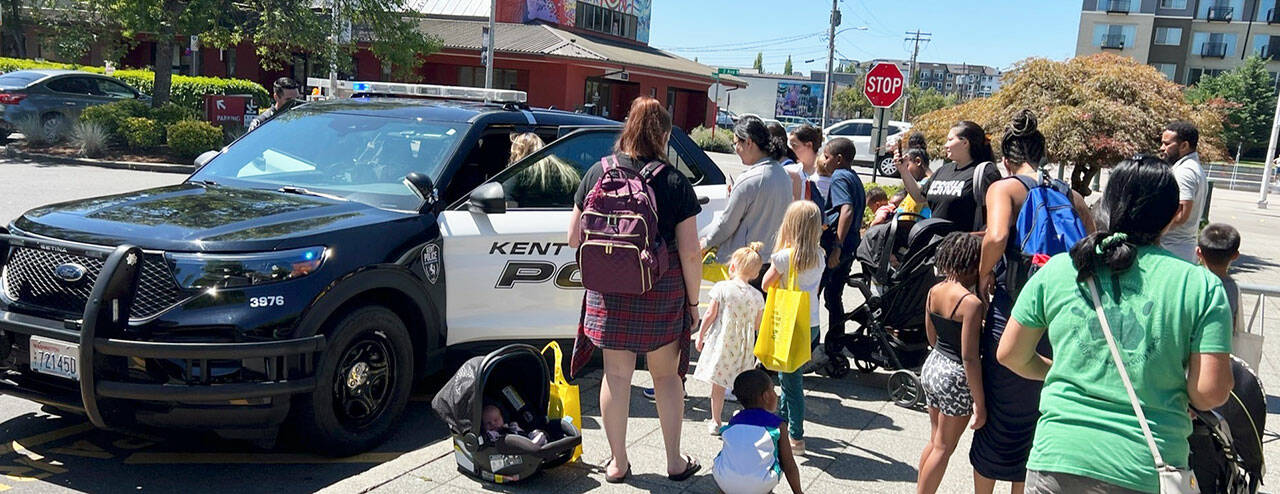 People get a chance to check out a Kent Police SUV during a National Night Out event Aug. 1 at the downtown Kent Library. COURTESY PHOTO, Kent Police