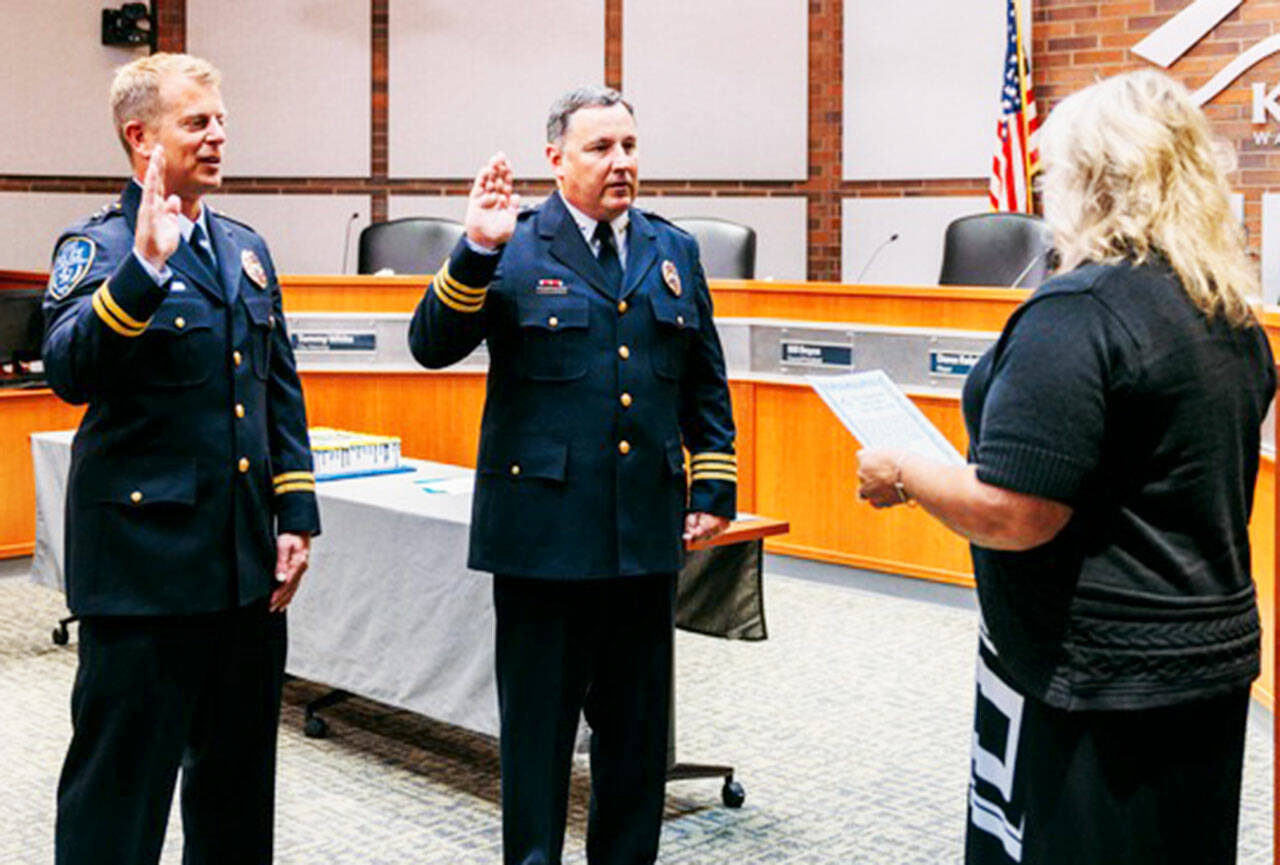 Mayor Dana Ralph swears in new Assistant Chief Andy Grove, left, and Deputy Chief Matt Stansfield. COURTESY PHOTO, Kent Police