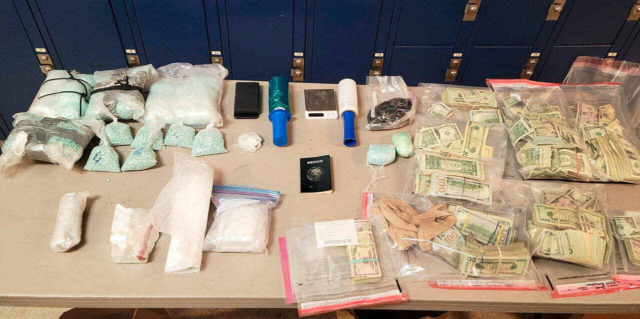 Seattle Police reportedly recovered fentanyl, cocaine, heroin and cash Aug. 14 from a Kent man’s residence in the 23900 block of 60th Avenue South. COURTESY PHOTO, Seattle Police