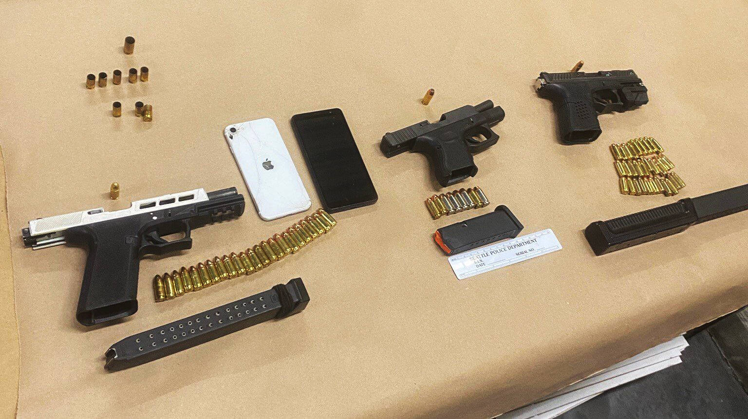 Seattle Police reported they found these guns after the arrest Aug. 16 of two felony suspects in Kent. COURTESY PHOTO, Seattle Police