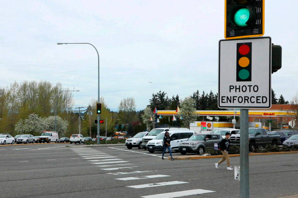A red-light camera sign at Pacific Highway South and Kent Des Moines Road, one of six intersections where the city of Kent has had cameras since 2019. COURTESY FILE PHOTO, Kent Police