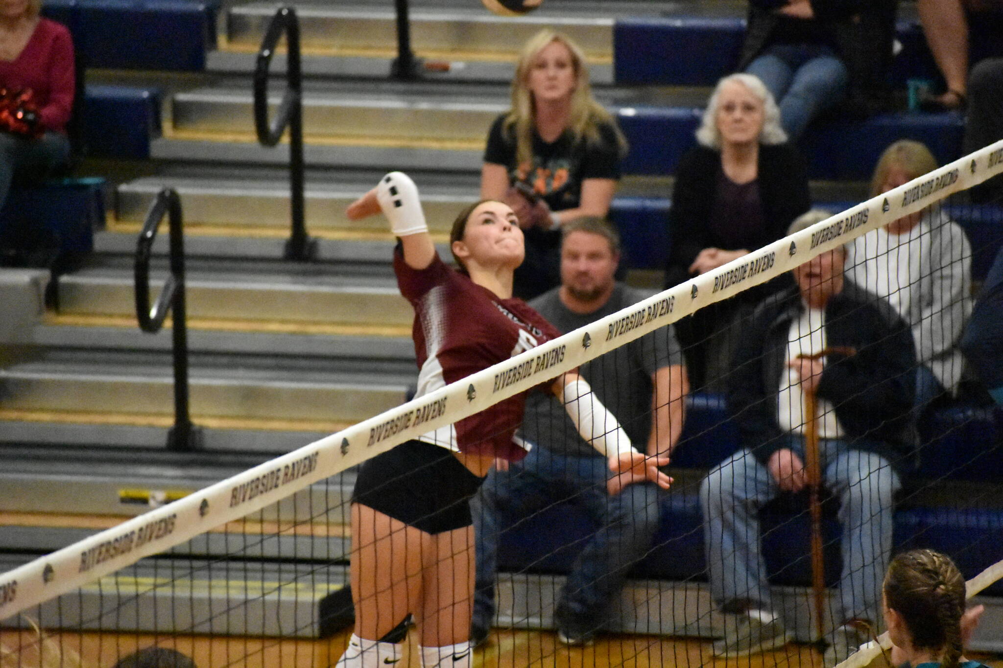 Freshman Kaylee Futch goes for a kill against the Ravens at Auburn Riverside. Ben Ray The Reporter
