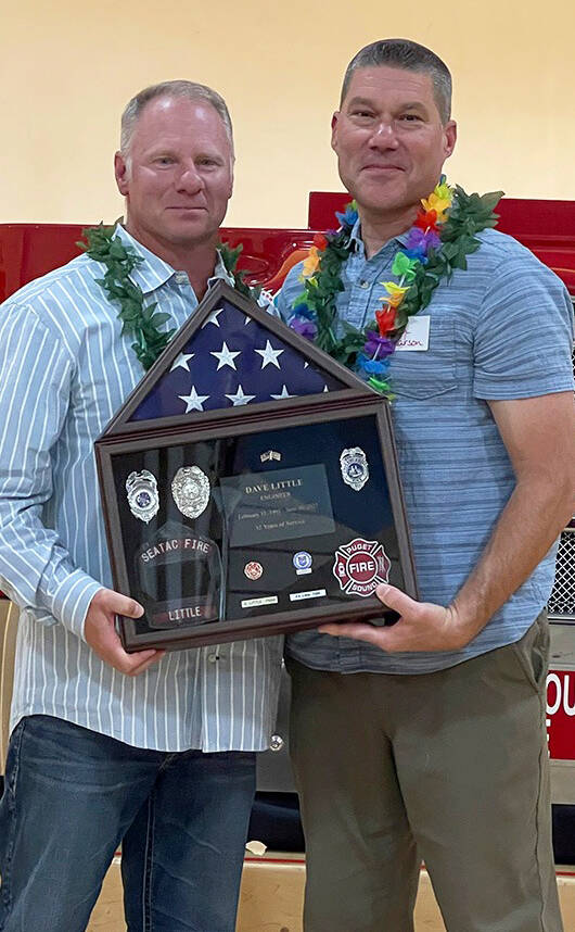 Dave Little, left, one of 14 firefighters who recently retired from Puget Sound Fire and honored by Fire Chief Brian Carson, right, at a Sept. 29 ceremony at the Kent Senior Center. COURTESY PHOTO, Puget Sound Fire