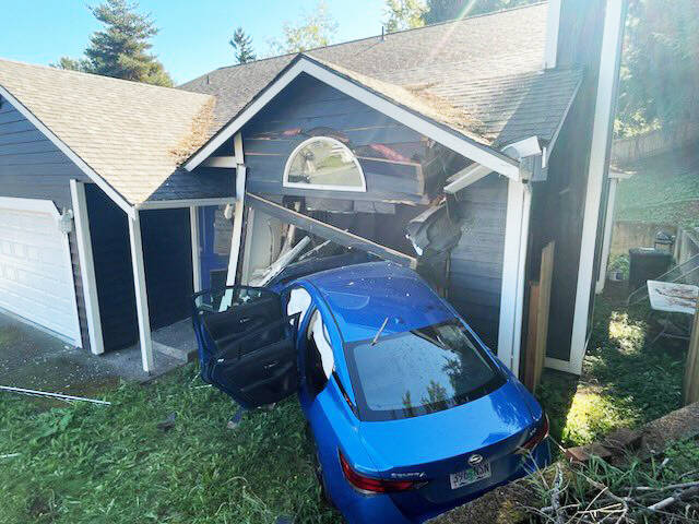 A car crashed into a Kent home Friday, Oct. 6 in the 11600 block of SE 223rd Drive. One person inside the home suffered minor injuries. COURTESY PHOTO, Puget Sound Fire