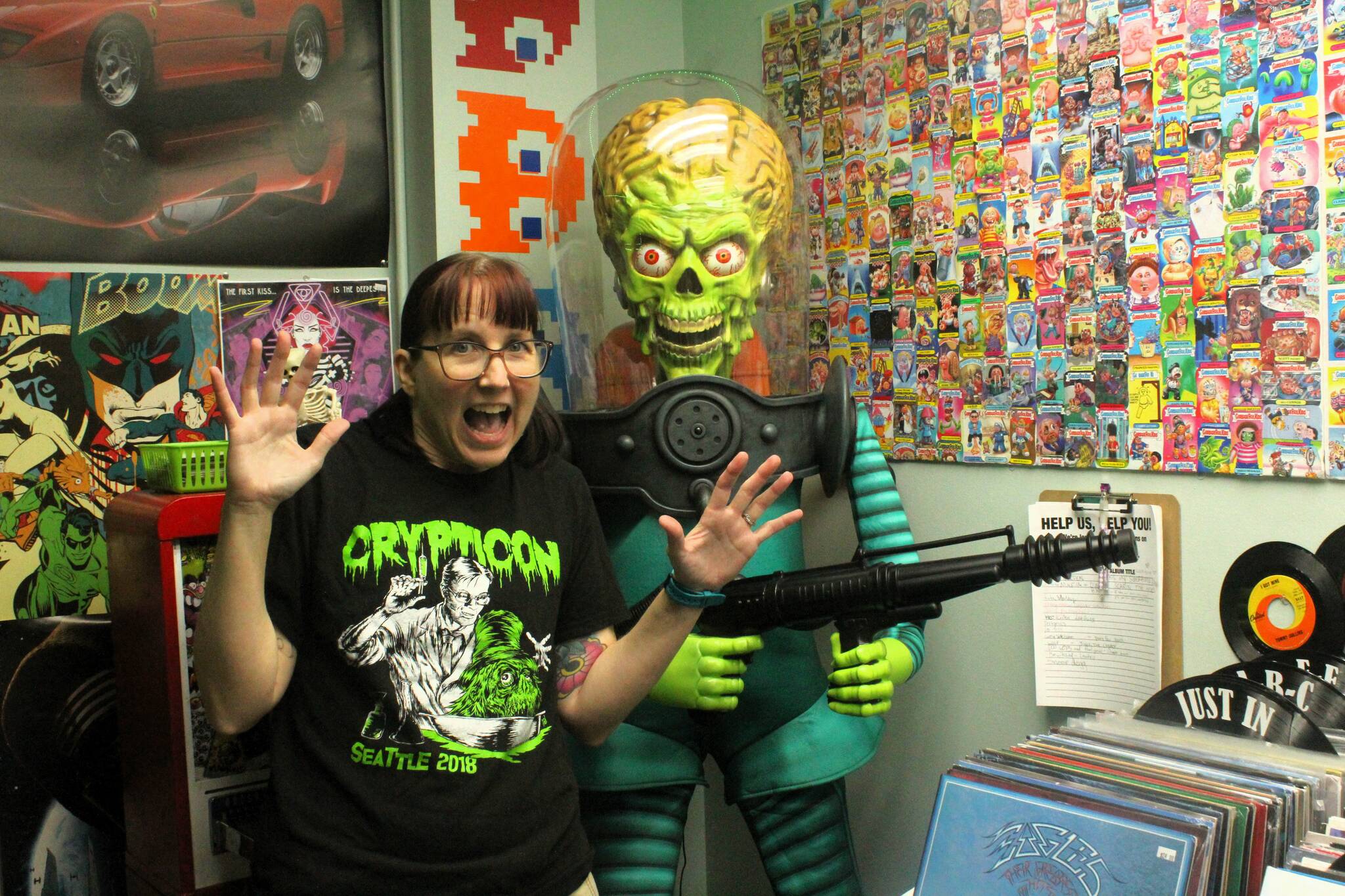 Anne Smith of Retro Emporium in Kent with an alien invader from "Mars Attacks!". Photo by Bailey Jo Josie/Sound Publishing.