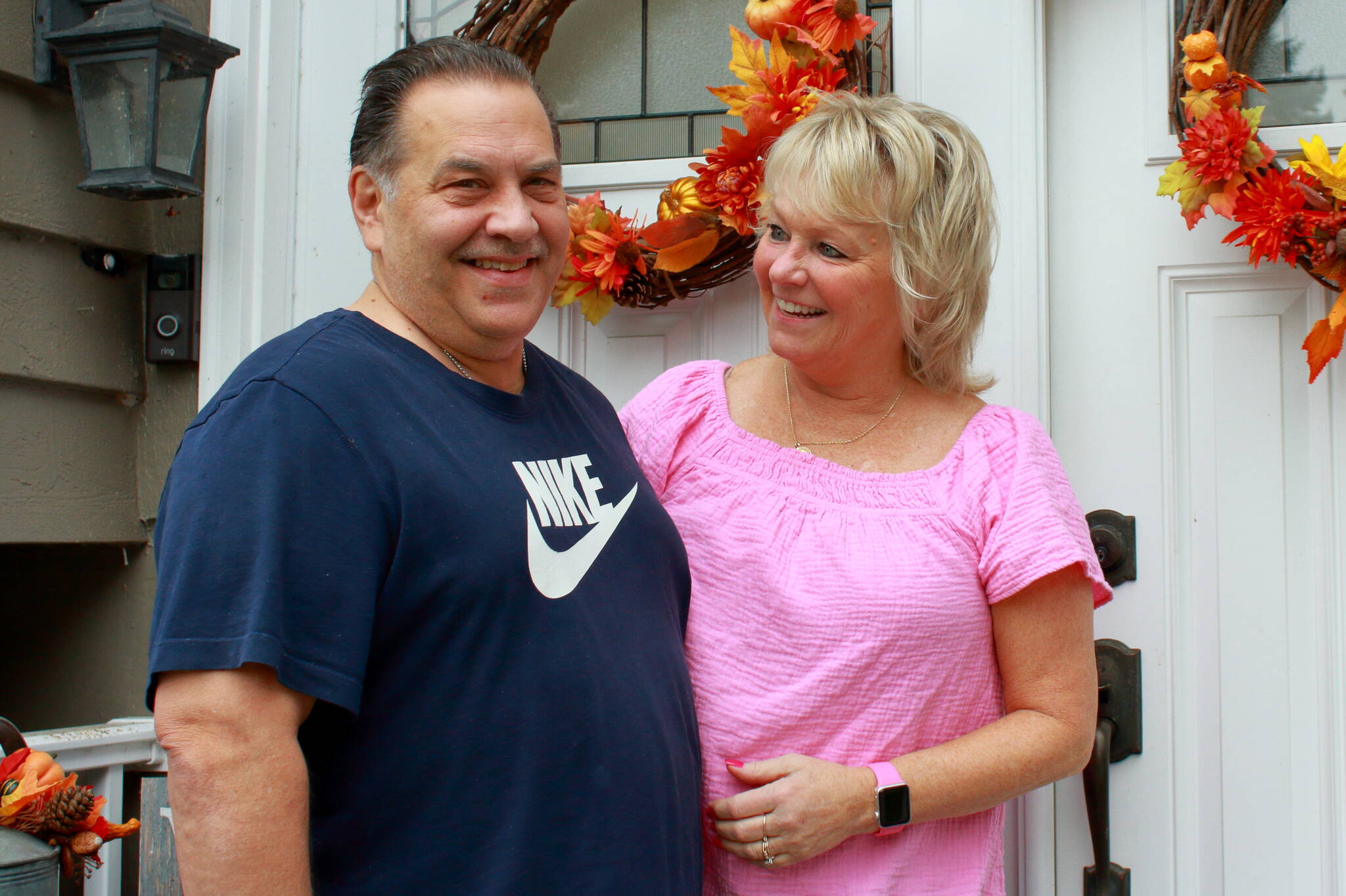 Dale and Denise Pac in front of their family home. Photo by Keelin Everly-Lang / The Mirror
