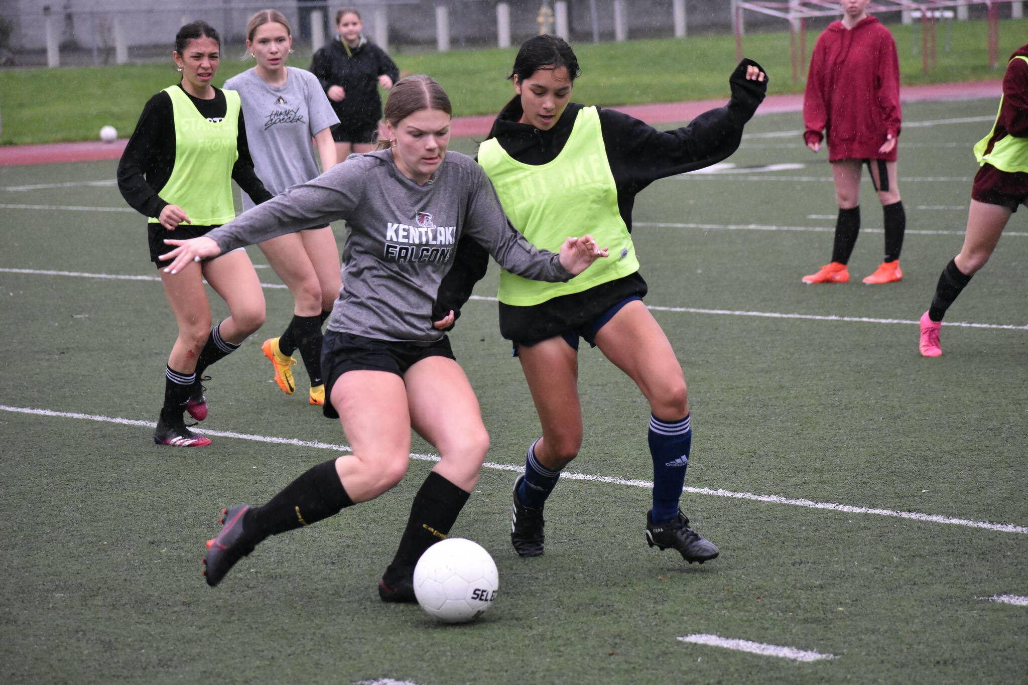 Layni Culp battles a teammate for possession. Ben Ray / The Reporter