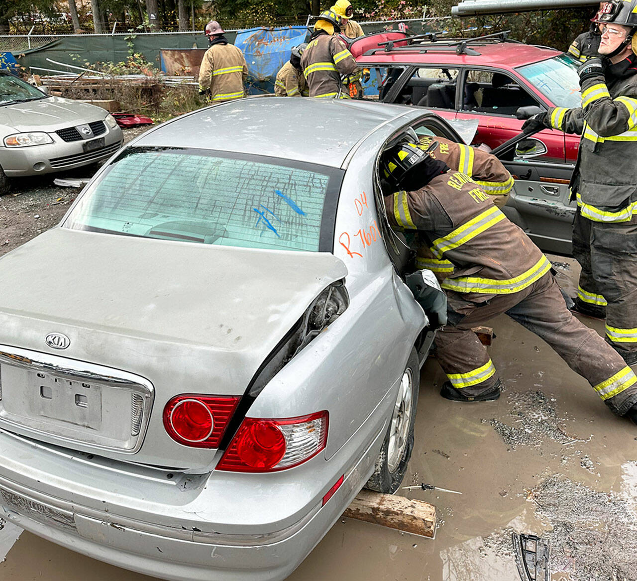 Firefighting recruits learn auto extrication skills. COURTESY PHOTO, Puget Sound Fire