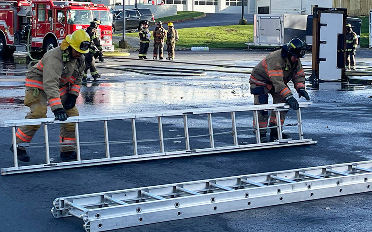 Recruit firefighters learn how to handle ladders. COURTESY PHOTO, Puget Sound Fire