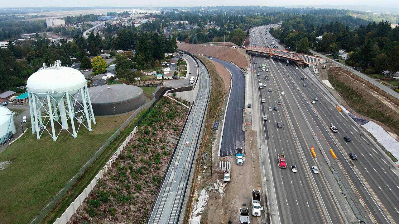 Dark, new asphalt clearly shows the path of a new on-ramp from the southbound SR 509 Expressway, still under construction, to southbound I-5 in the Kent, Des Moines, and SeaTac areas. COURTESY PHOTO, WSDOT