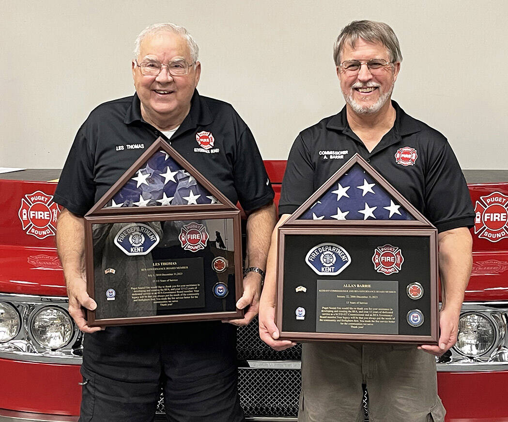 Les Thomas, left, and Allan Barrie receive recognition from Puget Sound Fire for their 13 years as board members. COURTESY PHOTO, Puget Sound Fire