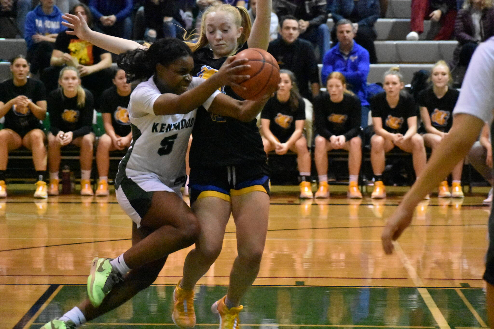 Kentwood’s Jessica Ajayi battles through the contact. Ben Ray / The Reporter