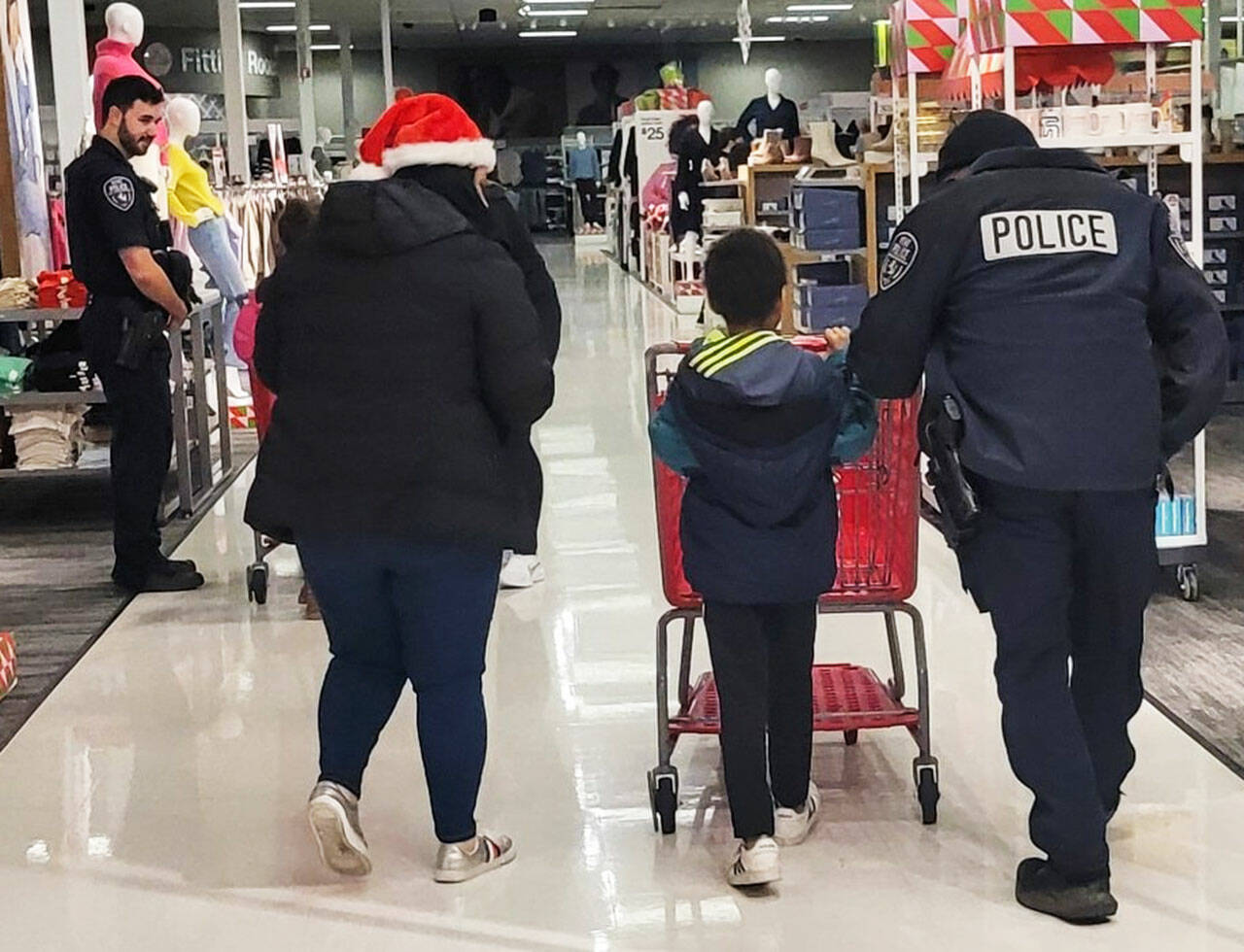 A child goes shopping at Target as part of the Kent Police Department’s Shop with a Cop. COURTESY PHOTO, Kent Police