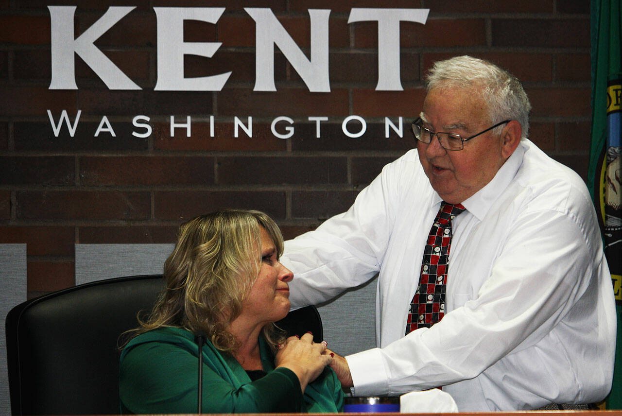 Kent City Councilmember Les Thomas tells Mayor Dana Ralph how much he enjoyed working with her. STEVE HUNTER, Kent Reporter