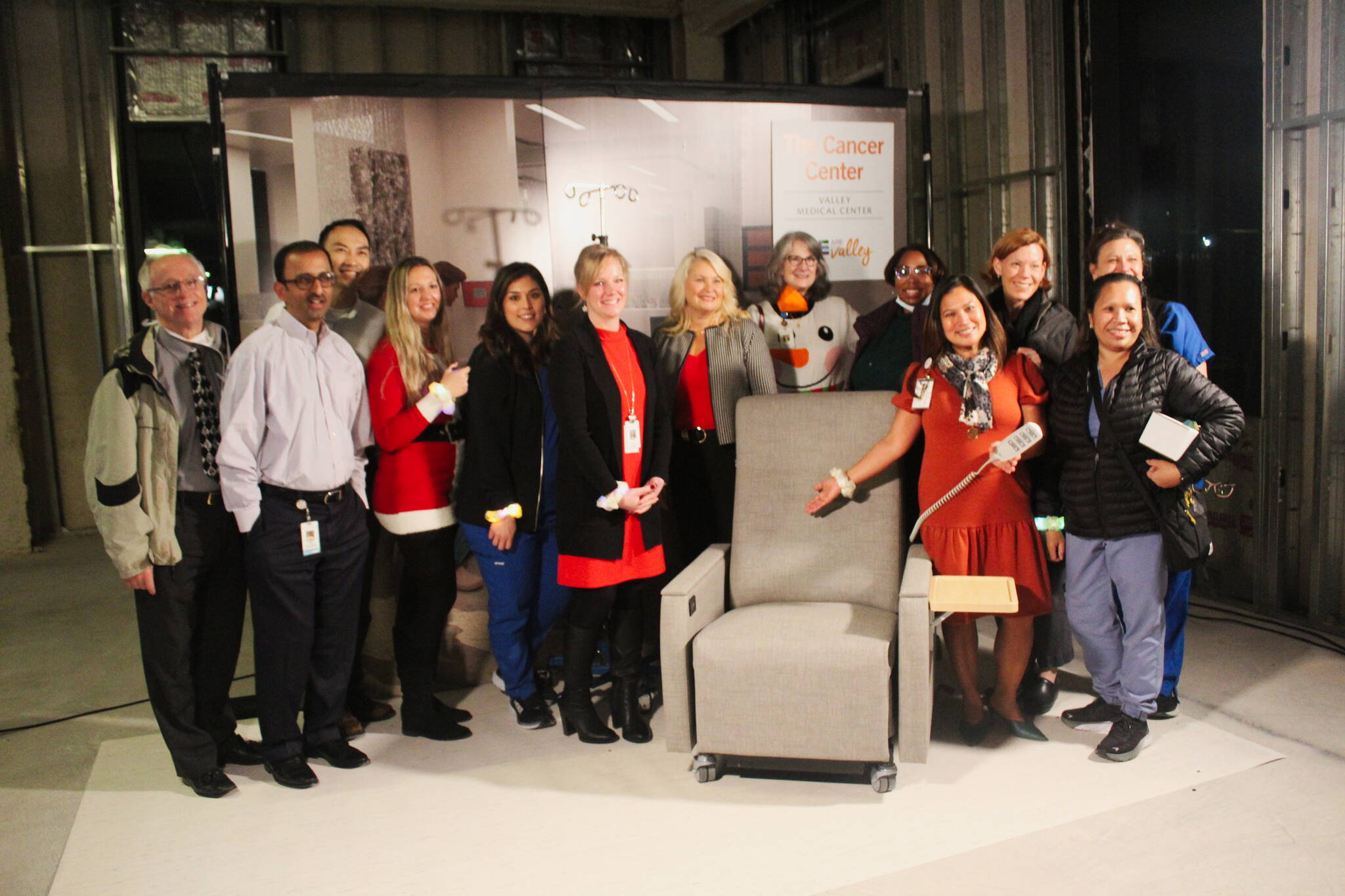 Members of the Valley Medical Oncology department pose with one of the chairs from the Infusion Center. Each chair costs $6,000. (Photo by Bailey Jo Josie/Sound Publishing)