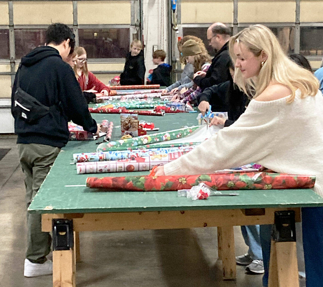 Volunteers wrap gifts for the annual Toys for Joy program. COURTESY PHOTO, Puget Sound Fire