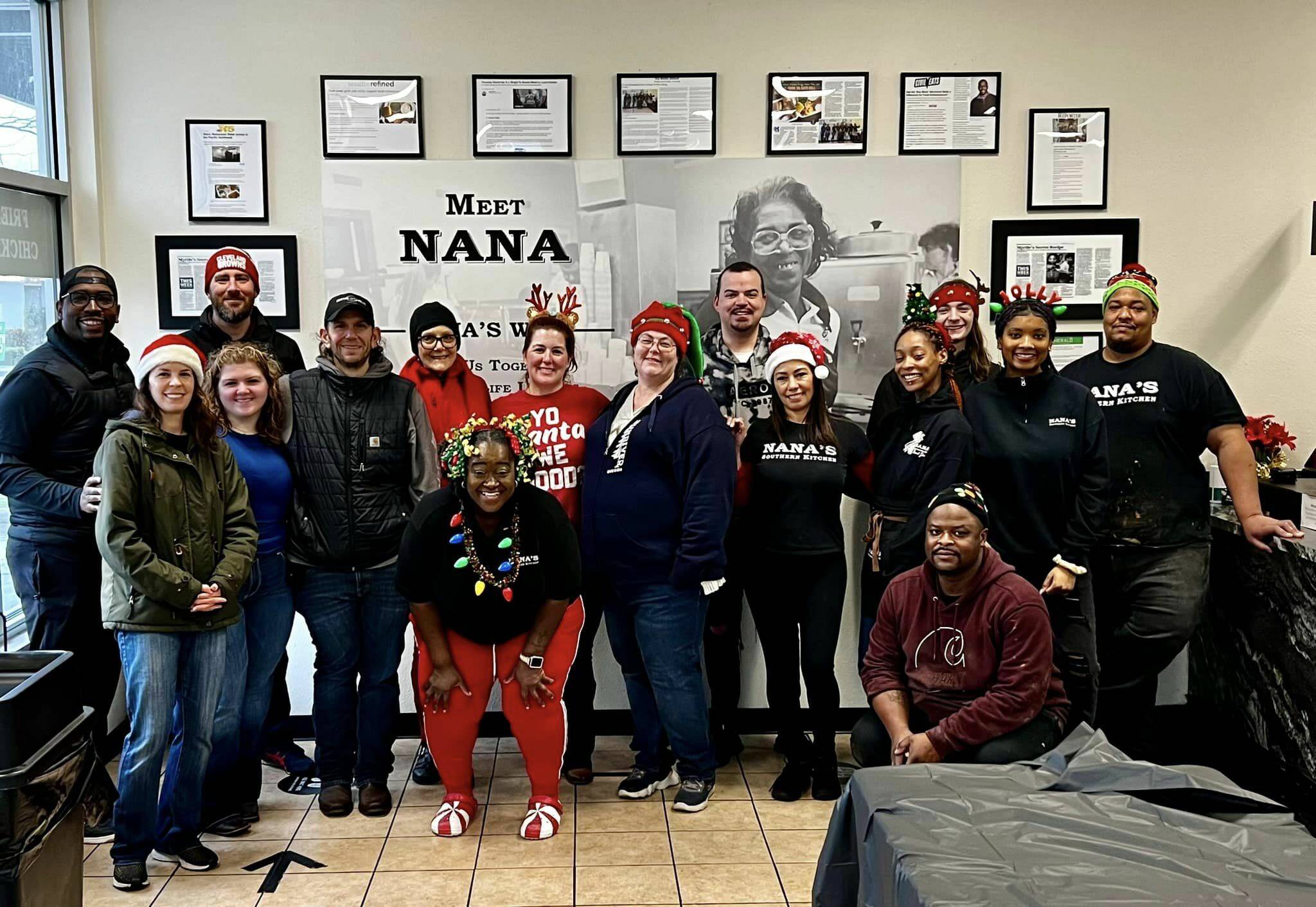 Christmas Day free meal event volunteers inside Nana’s Southern Kitchen. Owner Todd Minor is at the far left, just behind Kent City Councilmember Zandria Michaud. COURTESY PHOTO, Nana’s Southern Kitchen