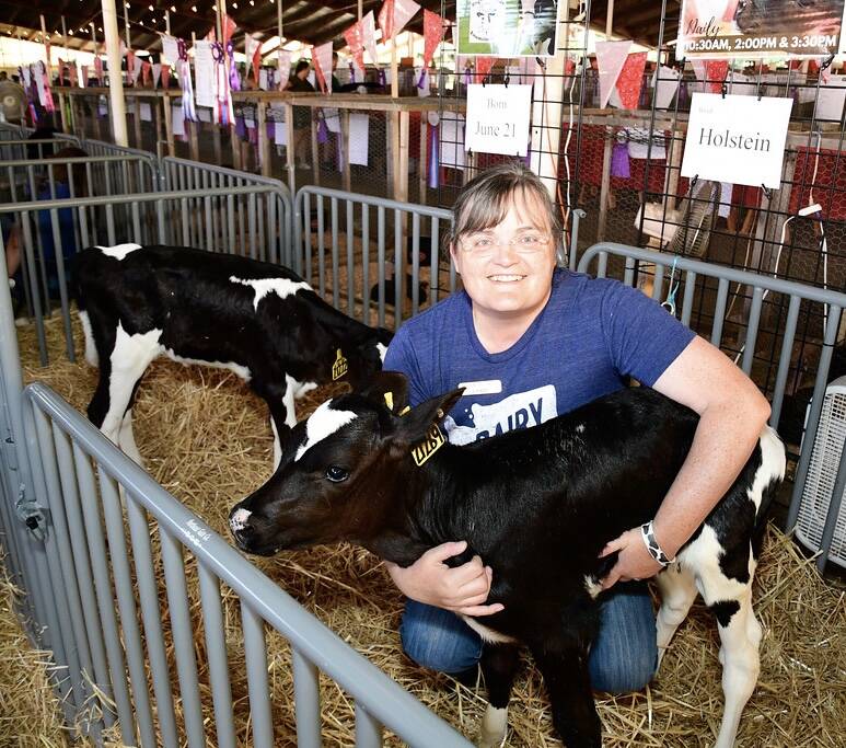 New King County Agricultural Commissioner Leann Krainick with one of her calves at the last King County Fair. Photo by Heather Curbow