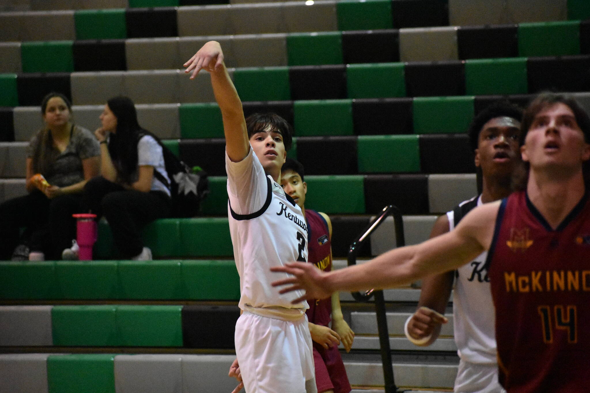 Sophomore Brandon Tagle holds the finish on a three pointer.