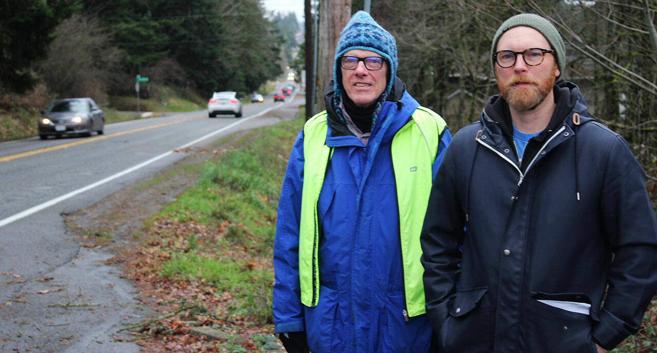 Ernie Downes, left, and Sam Hendricks stop along a stretch of 132nd Avenue SE in Kent near where 12-year-old Gabriel Coury was hit and killed by a vehicle in July 2023. STEVE HUNTER, Kent Reporter