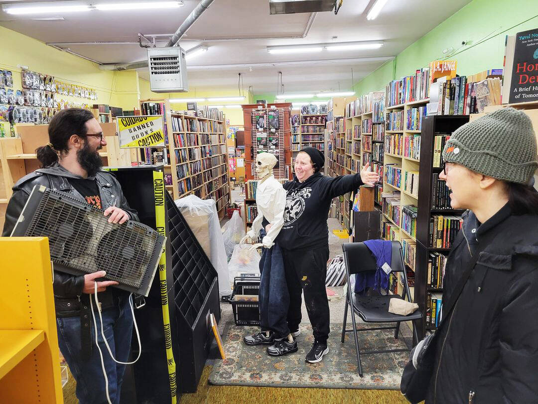 Volunteers gather to help clean up water damage at Page Turner Books in downtown Kent from pipes that bursted after the sub-freezing temperatures. COURTESY PHOTO, Page Turner Books