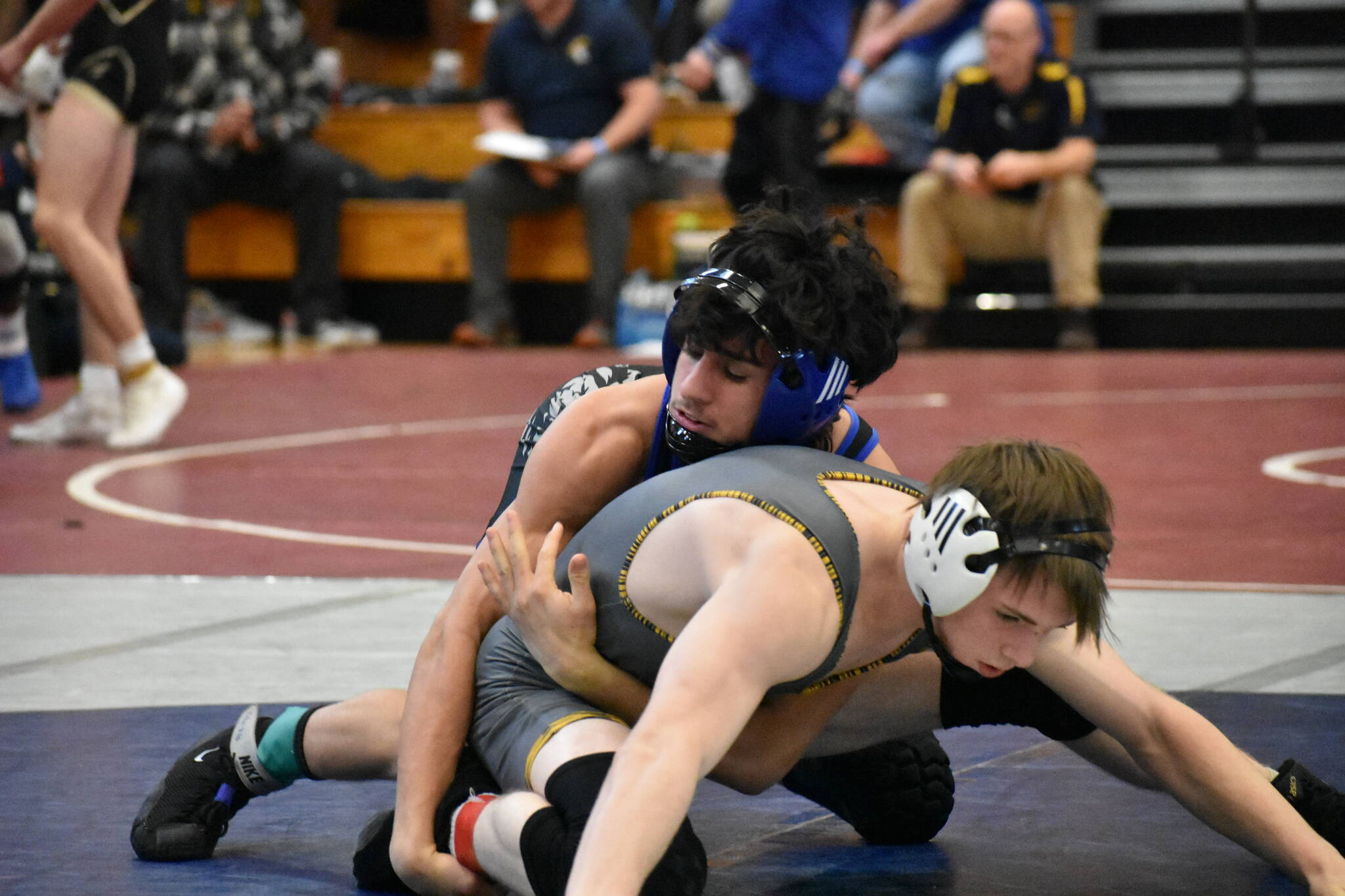 Kent-Meridian wrestler works in his opening match of the day at Todd Beamer. Ben Ray / The Reporter