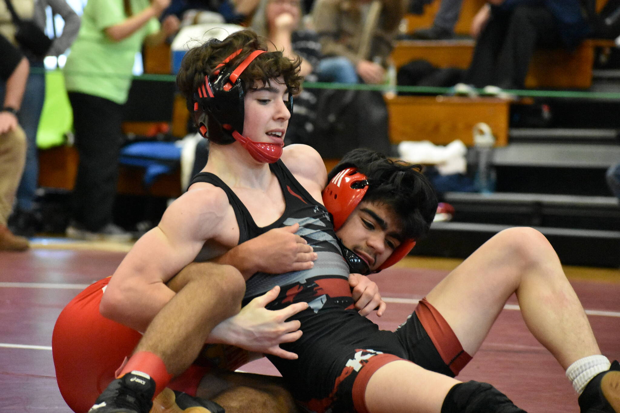 Kentlake wrestler attempts to pin his opponent from Mount Tahoma. Ben Ray / The Reporter