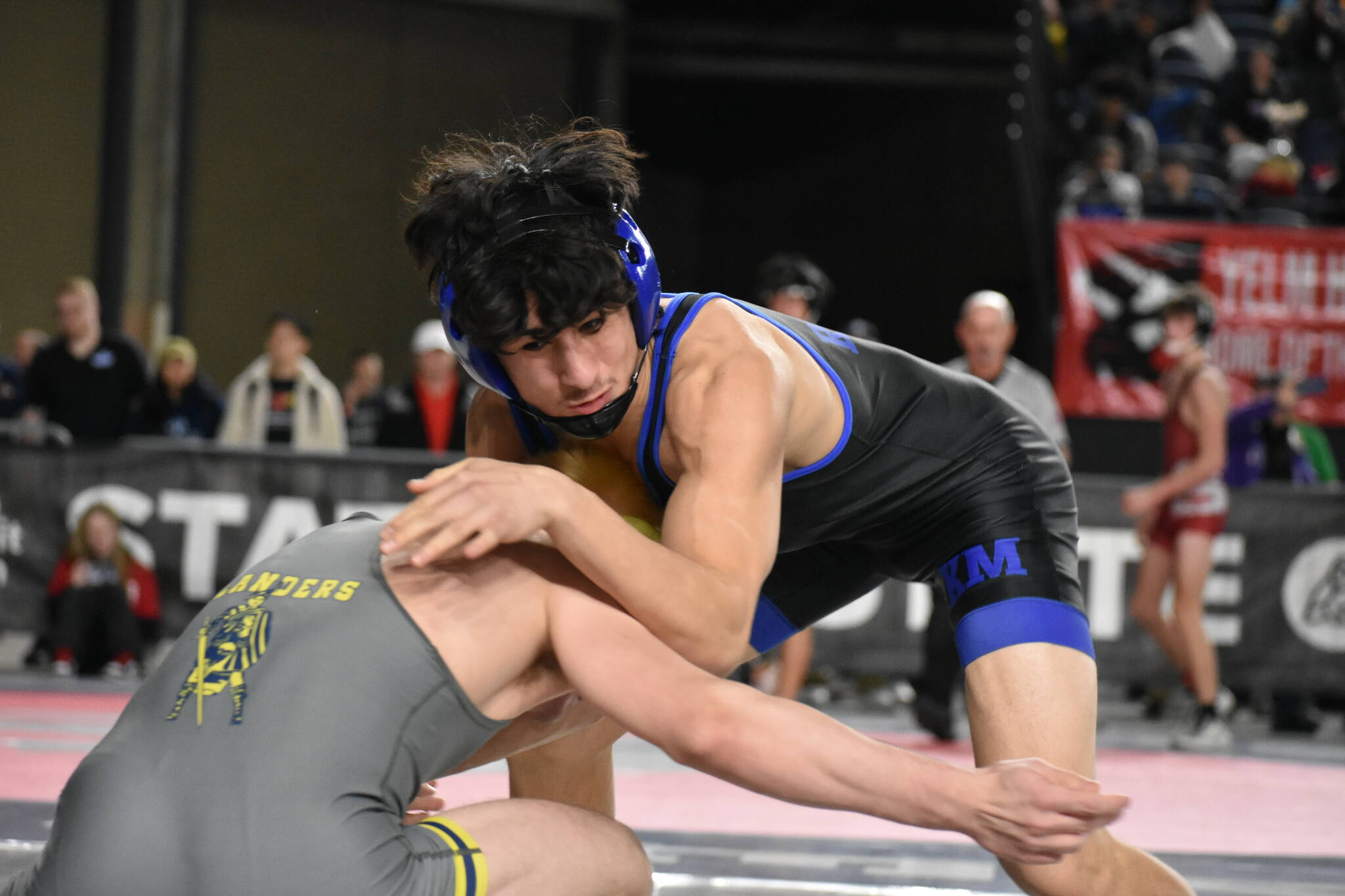 Adonai Garza wrestling on the first day of competition. Ben Ray / The Reporter