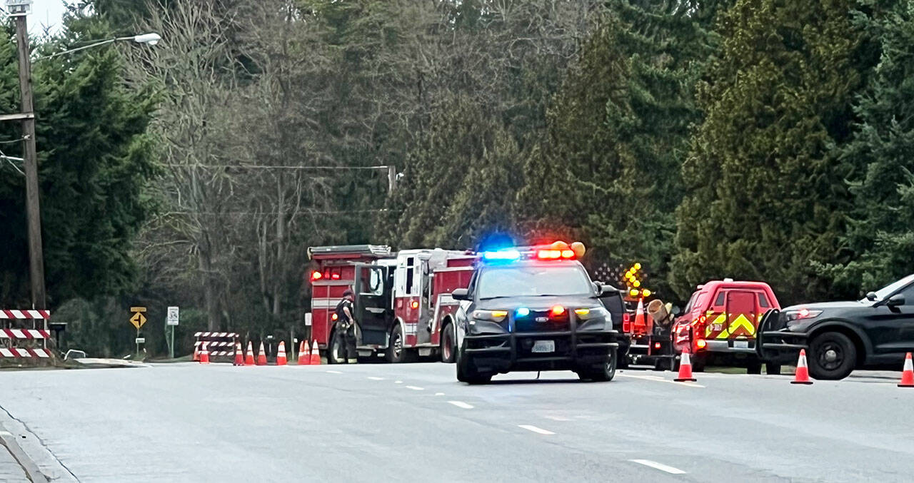 Emergency personnel respond to a single-car crash Tuesday morning, Feb. 20 along 132nd Avenue SE near Sunrise Elementary School. COURTESY PHOTO, Ernie Downes