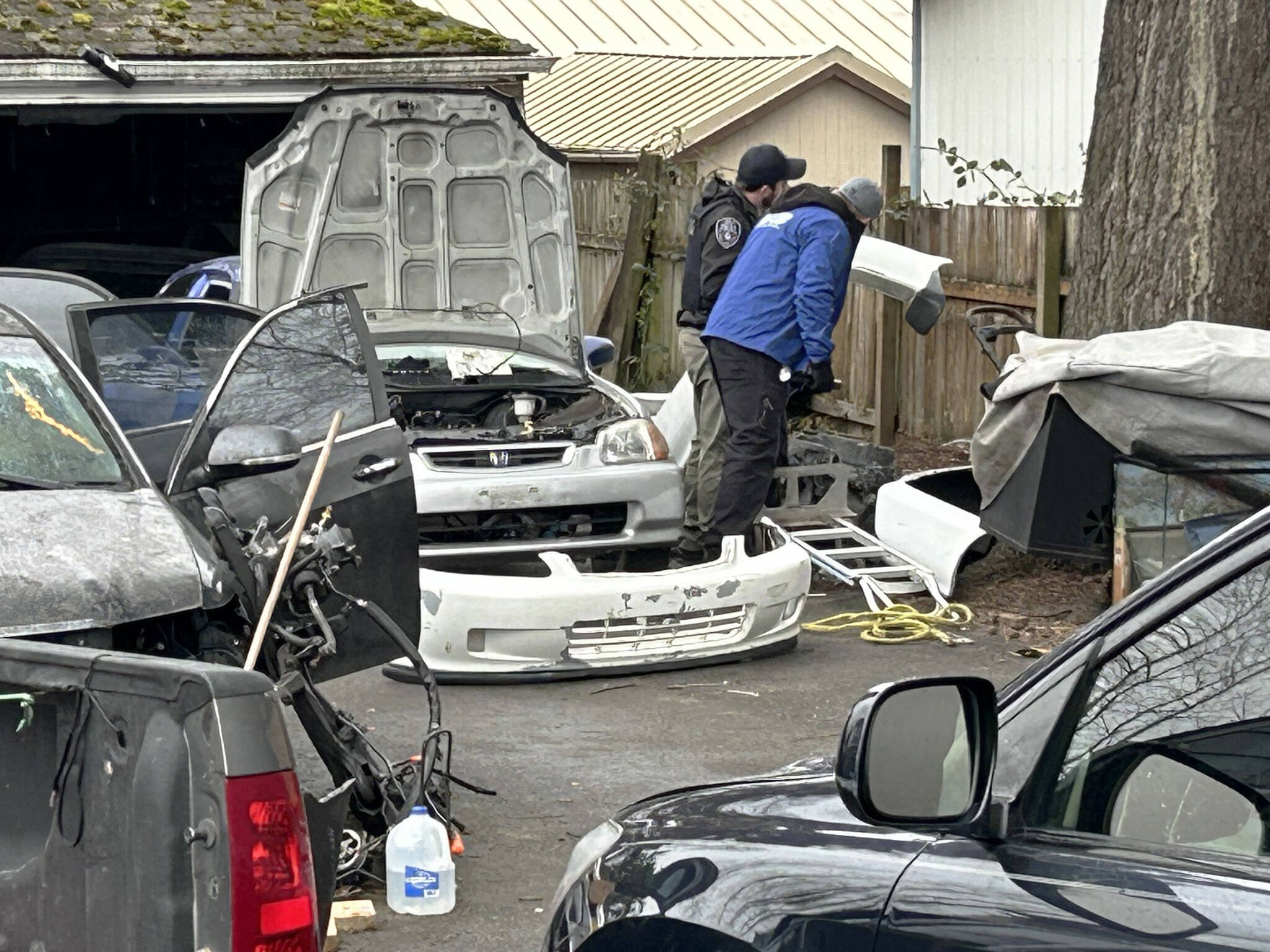 Officers search an alleged chop shop in Kent. COURTESY PHOTO, Kent Police