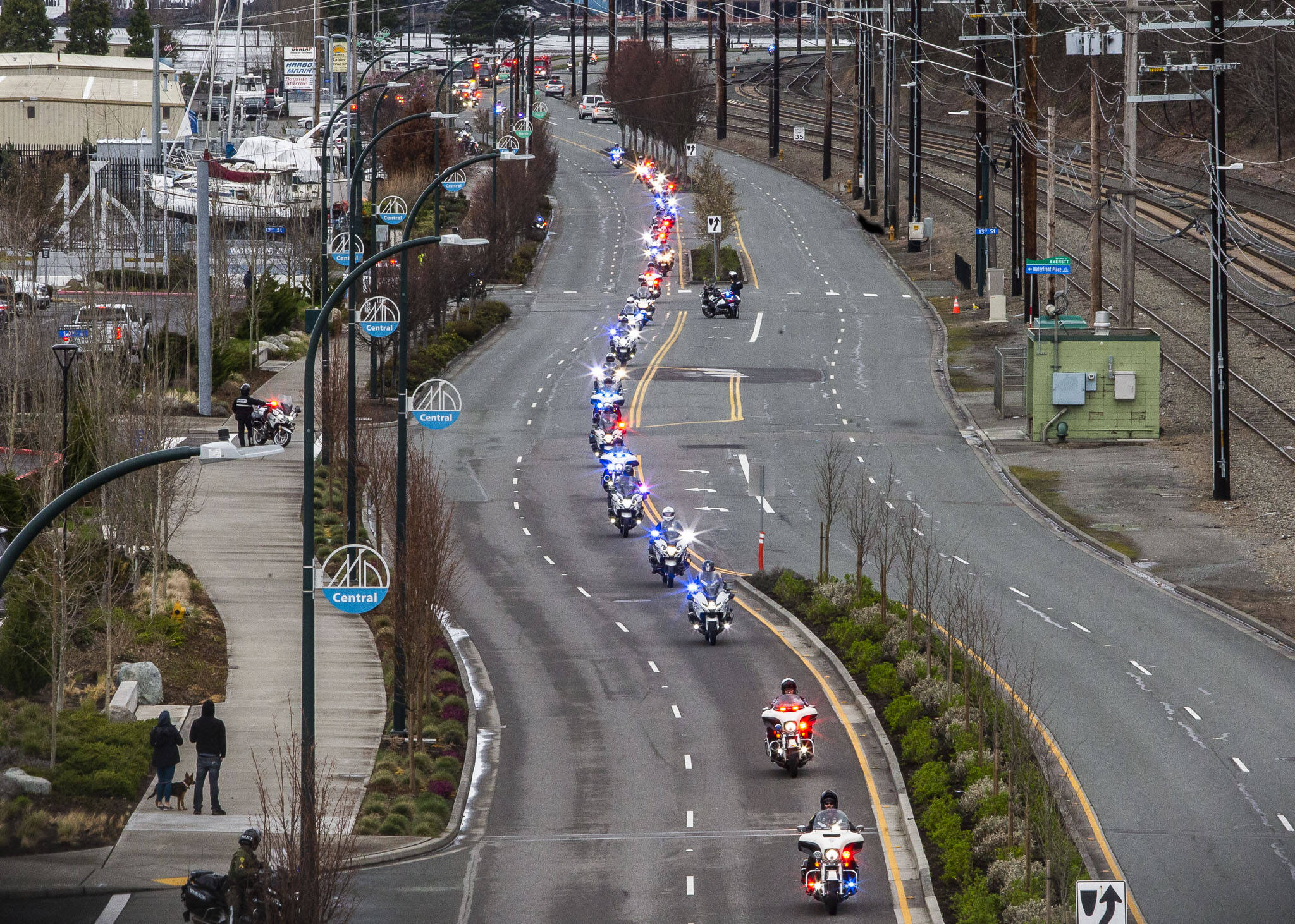 Washington State Patrol officers on motorcycles drive down Marine View Drive in a memorial procession for Washington State Trooper Christopher Gadd on Tuesday, March 12, 2024 in Everett, Washington. (Olivia Vanni / The Herald)