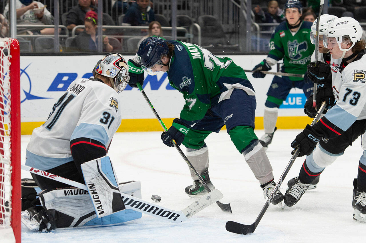 The Kent-based Seattle Thunderbirds’ Kazden Mathies takes a shot against Portland’s Jan Spunar on Sunday, March 17 at the Climate Pledge Arena in Seattle. COURTESY PHOTO, Brian Liesse, Seattle Thunderbirds