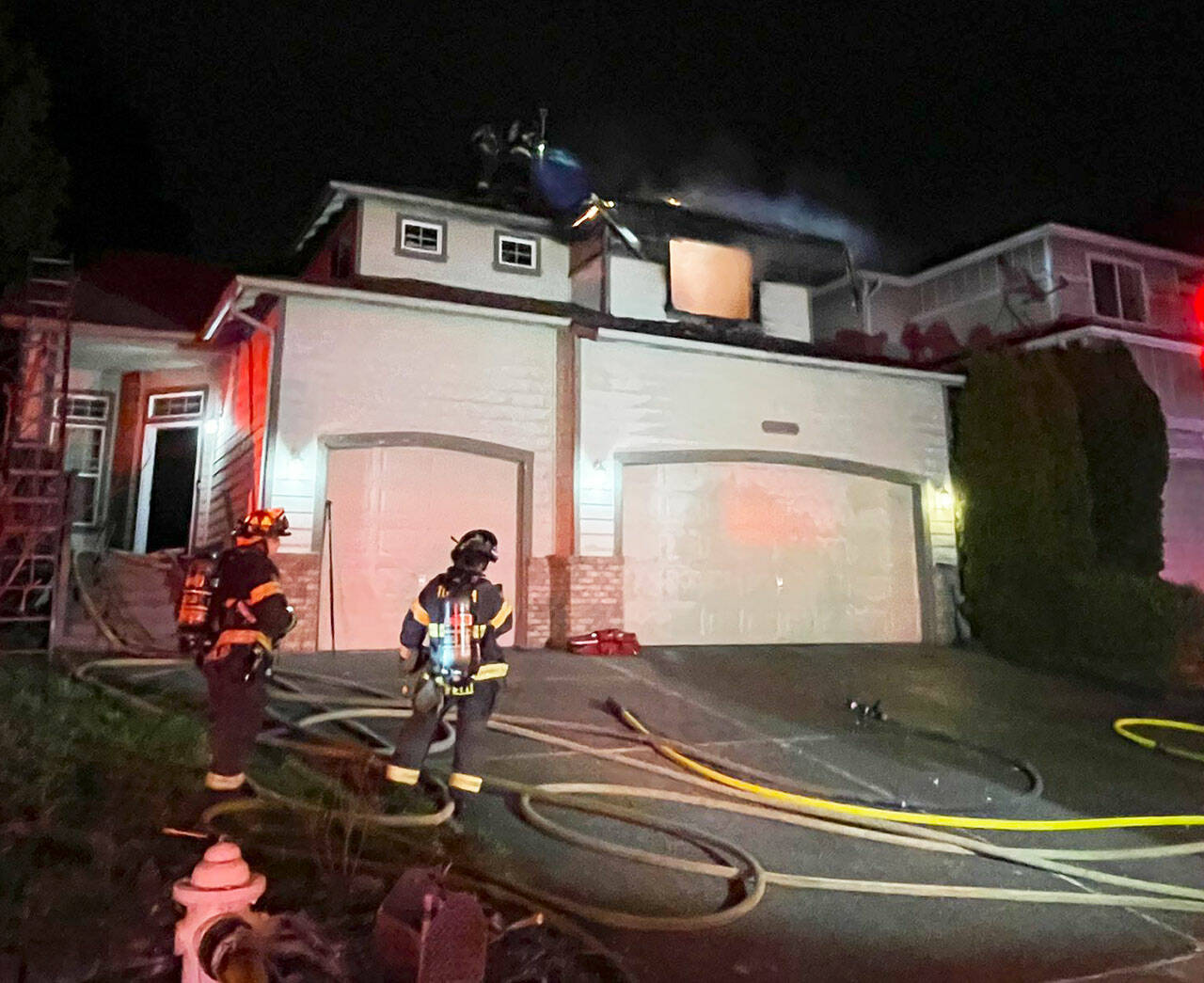 Firefighters respond to a March 19 fire at a home on the East Hill in Kent. COURTESY PHOTO, Puget Sound Fire