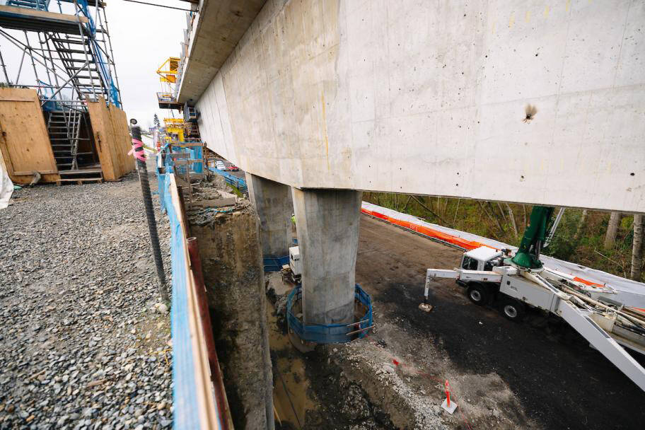 On both sides of the bridge’s 500-foot center span in Kent, double columns support angled “pier tables.” Below the surface, foundation shafts measuring more than 12 feet in diameter plunge 110 feet deep into the ground, embedded in rocky sediment deposited by ancient glaciers. COURTESY PHOTO, Sound Transit
