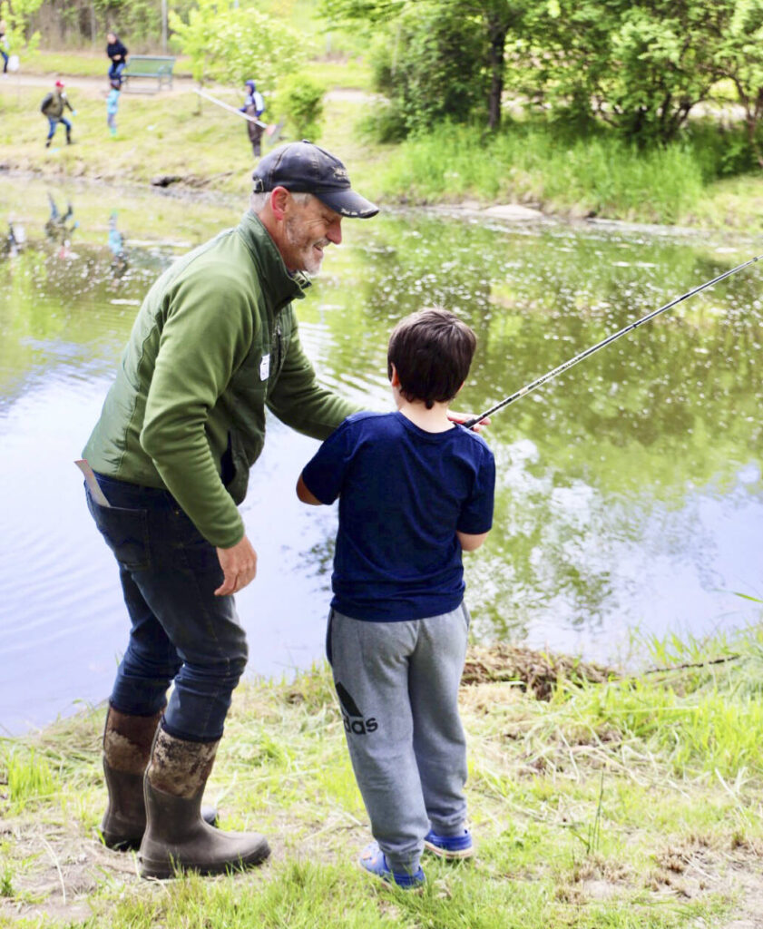 Kids learn how to catch fish in Kent at the Old Fishing Hole Kent